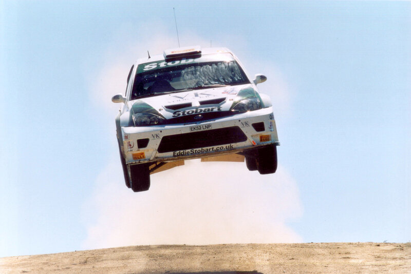 Rally car in mid-air jump