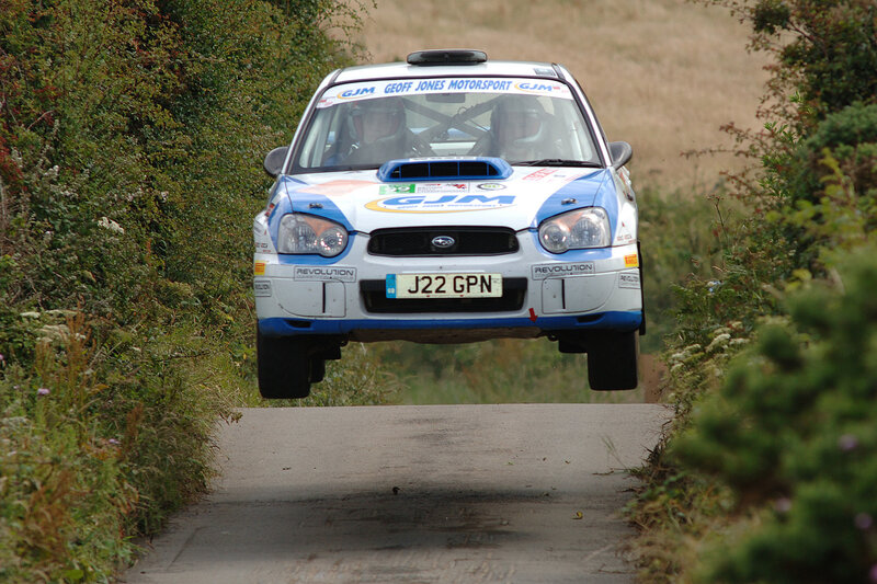 Rally car in mid-air jump