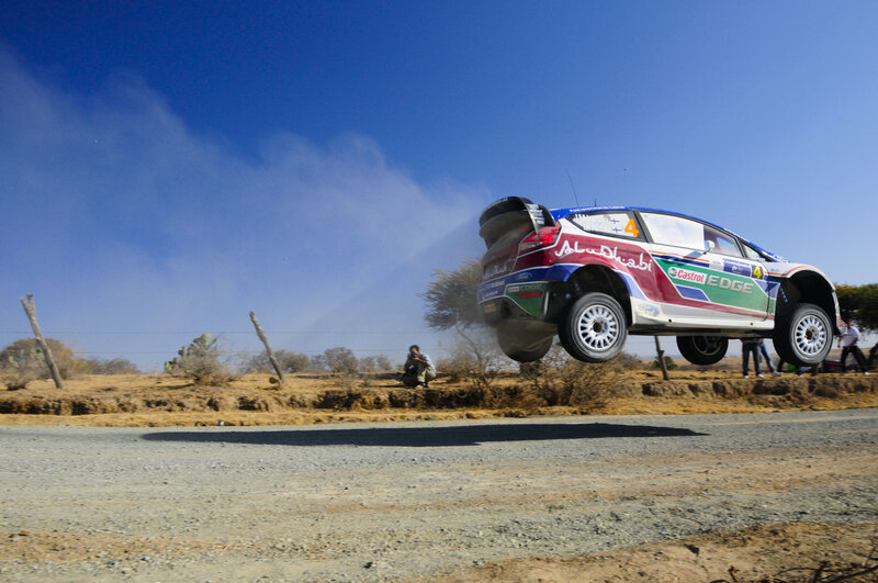 Rally car in mid-air jump