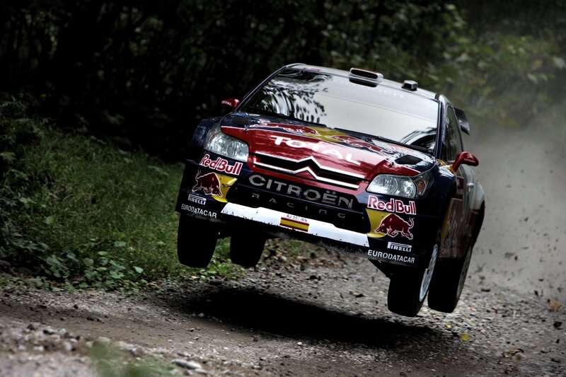 rally car in mid-air jump
