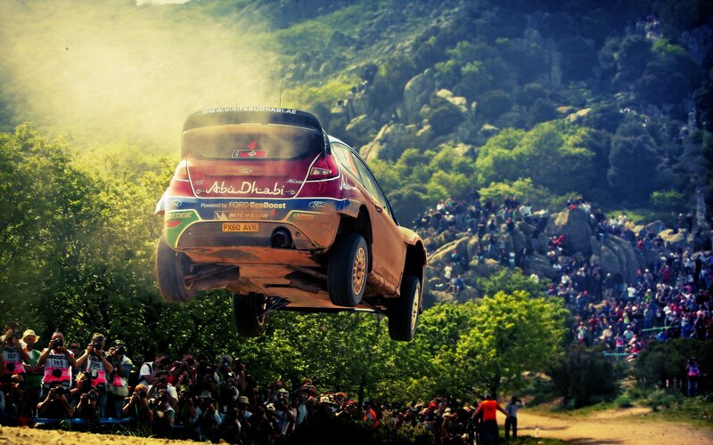 Rally car in mid-air jump