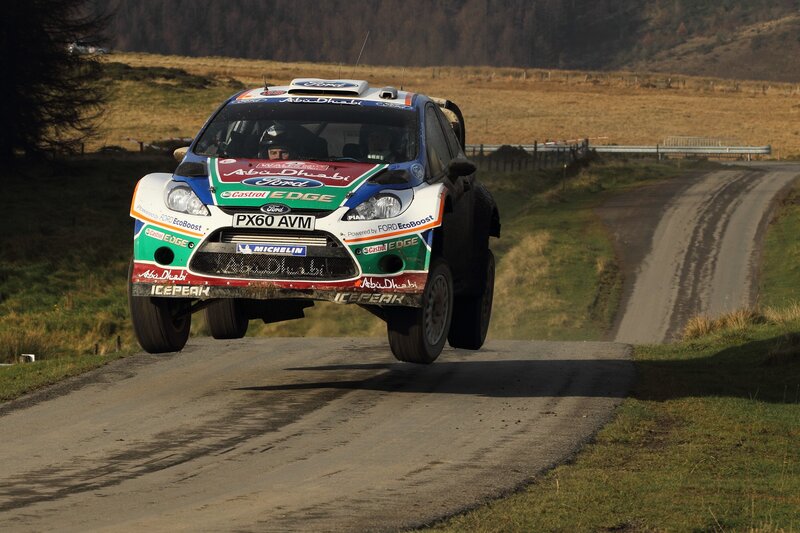 Rally car in mid-air jump