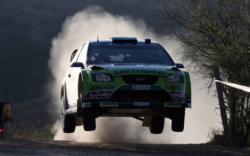 Rally car in mid-air jump