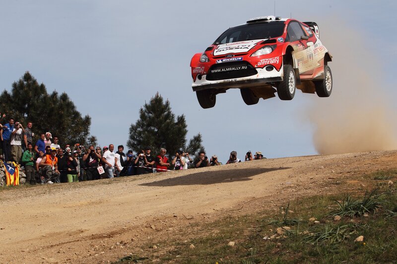 Rally car in mid-air jump