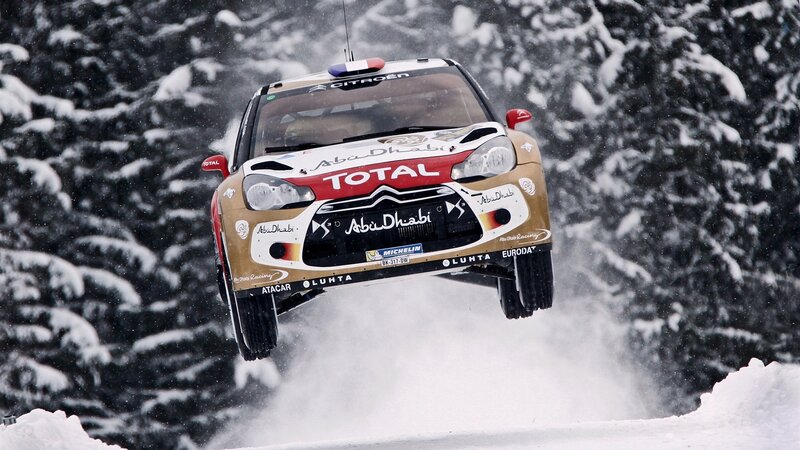 Rally car in mid-air jump