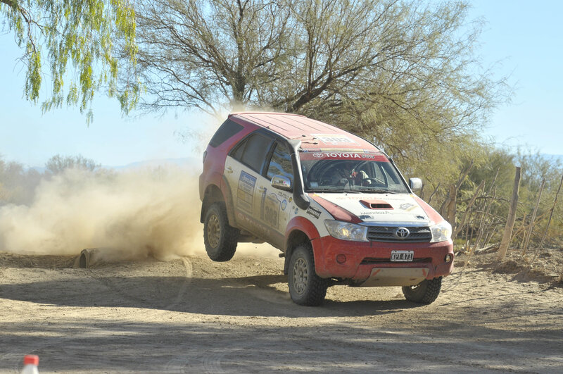 Rally Car in Mid-air — Red, Dynamic, Afternoon