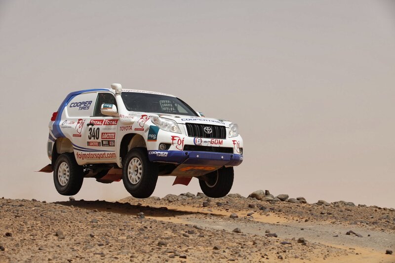 Rally Car in Mid-air — White, Dynamic, Afternoon, Photograph, Dirt Road
