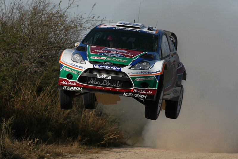 Rally Car in Mid-air — White, Dynamic, Afternoon