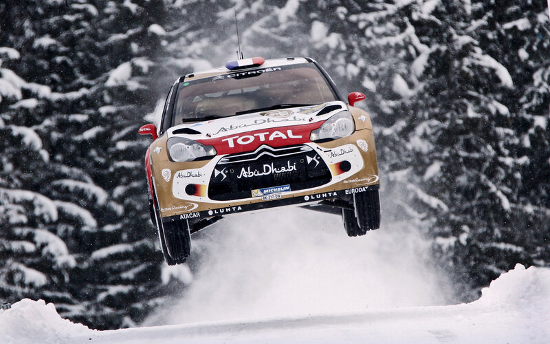 Rally Car in Mid-air — White, Dynamic, Winter