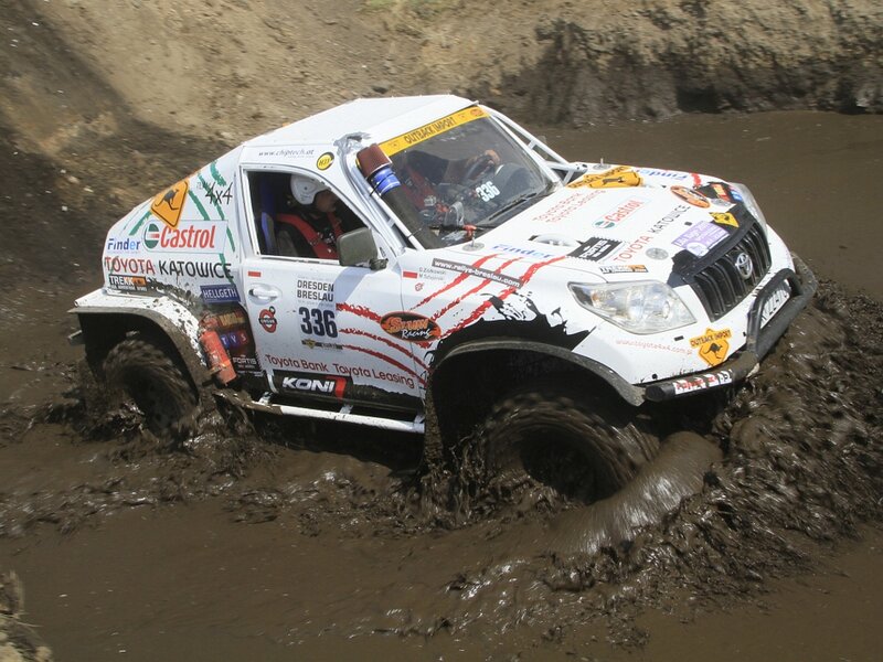 Rally Car in Mud — White, Action-packed