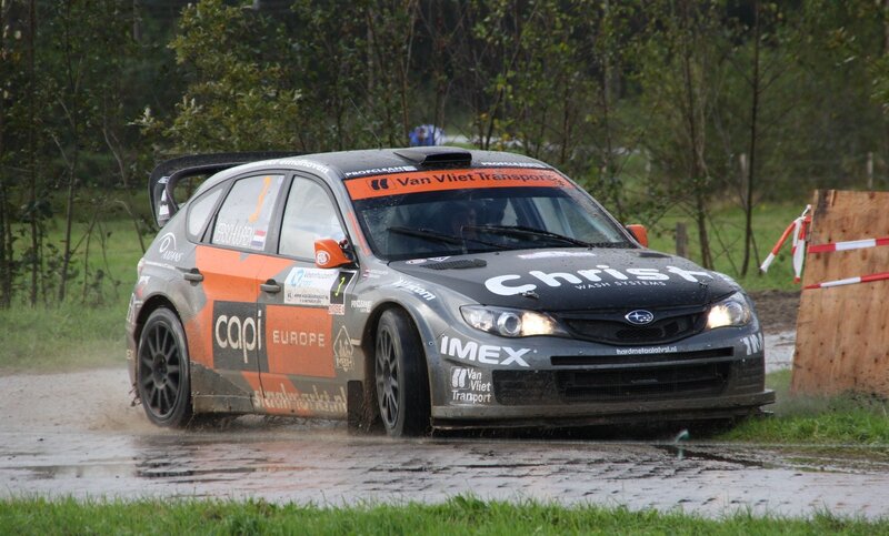 rally car in muddy conditions