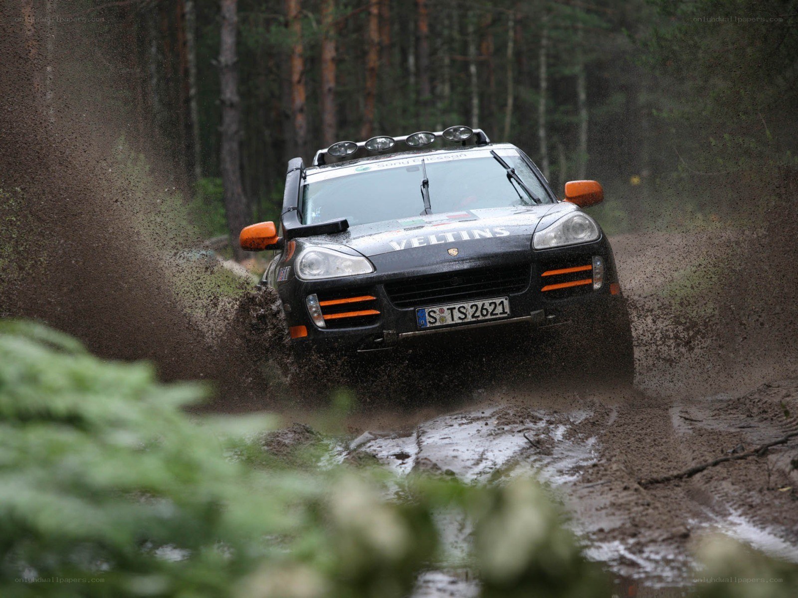 Rally car in muddy forest