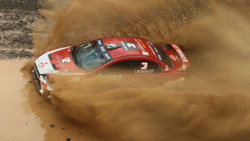 rally car in muddy terrain