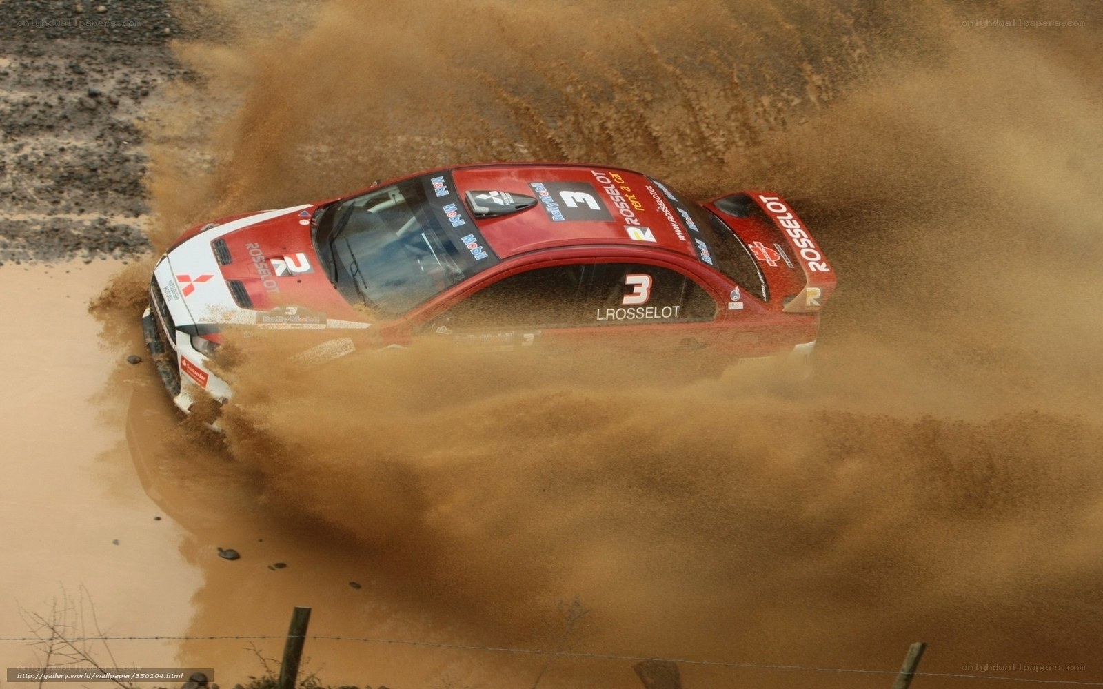 rally car in muddy terrain