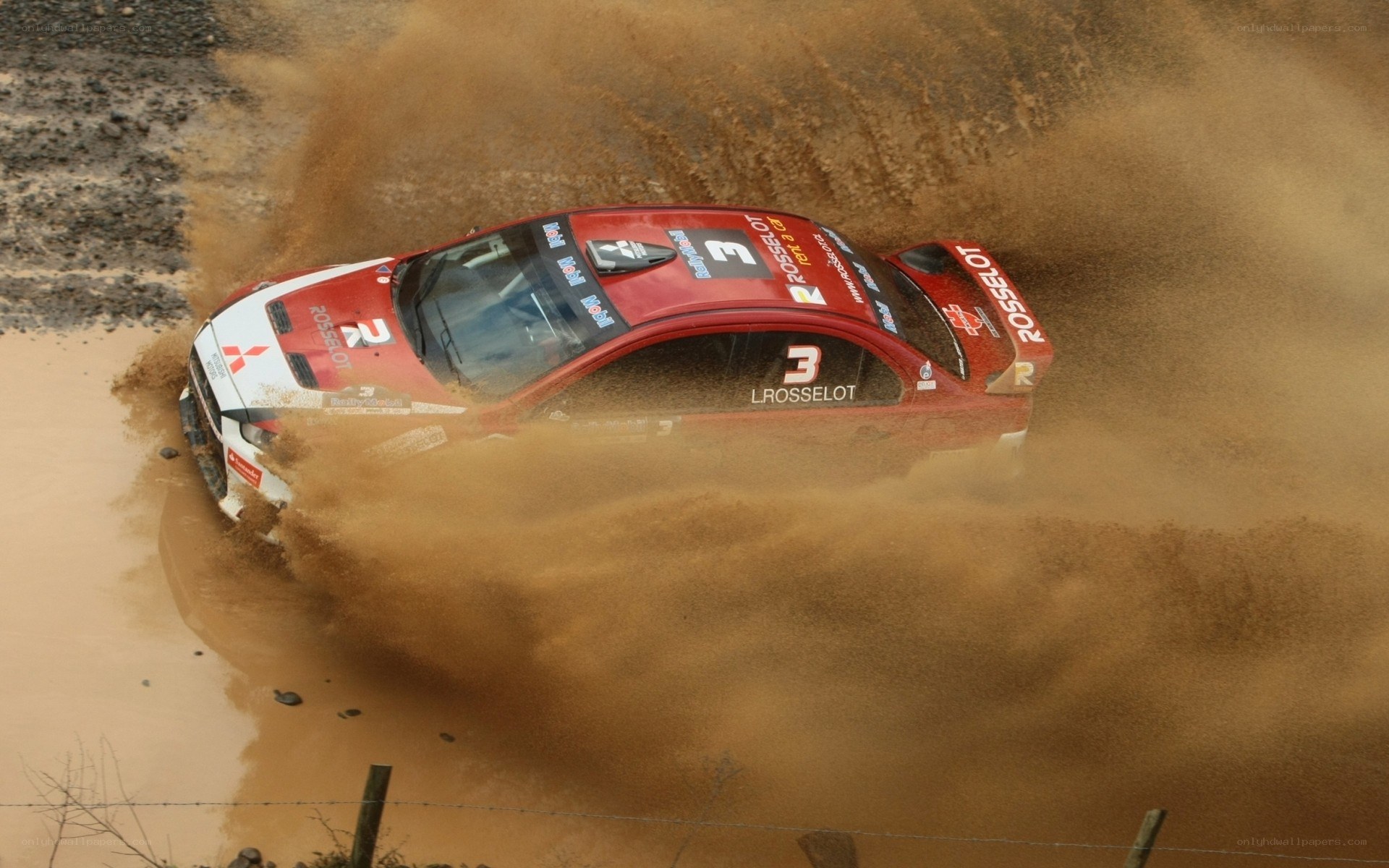 rally car in muddy turn