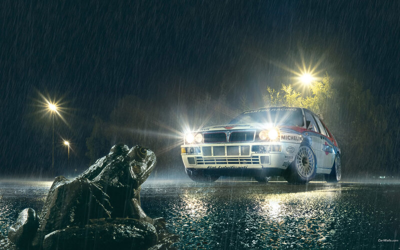 Rally car in rain at night