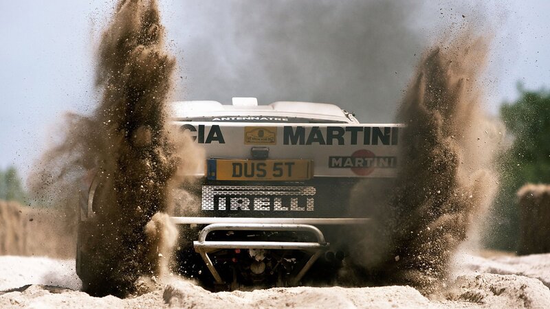 Rally Car in Sand — Brown, Dynamic, Dusty