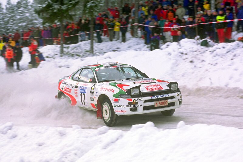 Rally Car in Snow — White, Dynamic, Winter, Photograph, Crowd, Trees
