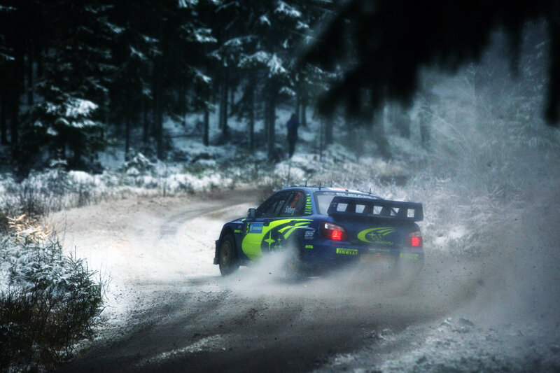rally car in snowy forest