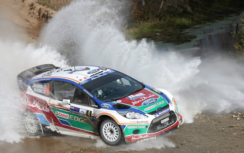 Rally Car in Water — White, Dynamic, Afternoon