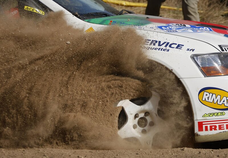 Rally Car Kicking Up Dirt — White