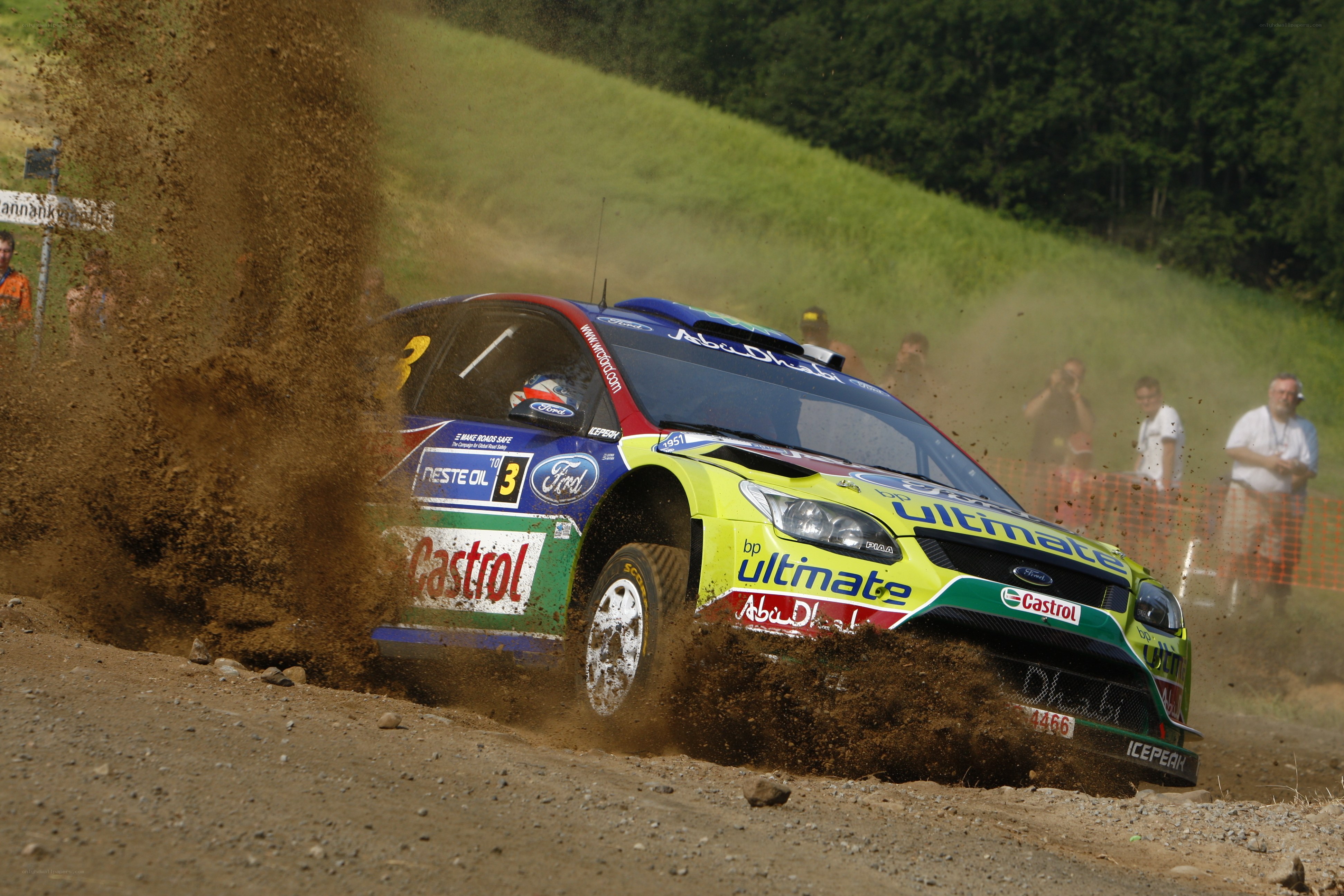 Rally car kicking up dirt