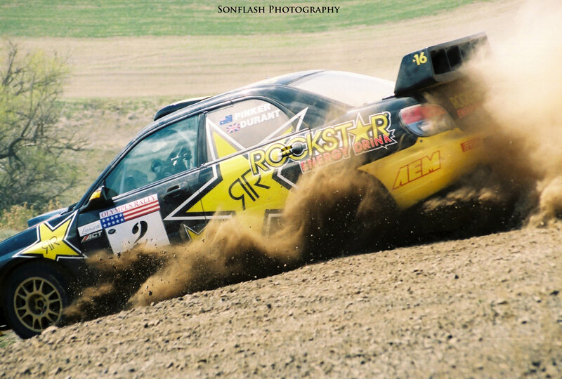 Rally car kicking up dust
