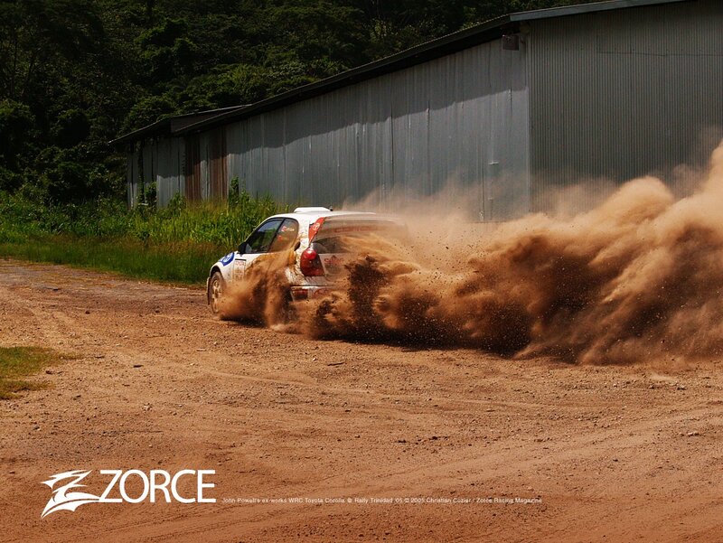 Rally car kicking up dust