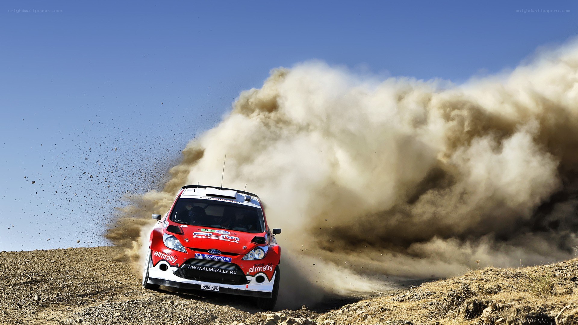 Rally car kicking up dust