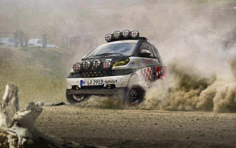 rally car kicking up dust