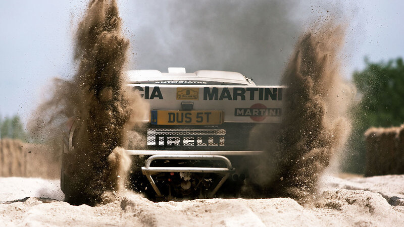 Rally car kicking up dust