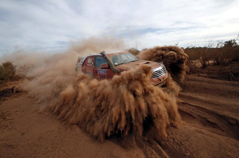 Rally Car Kicking Up Dust — Brown, Dynamic