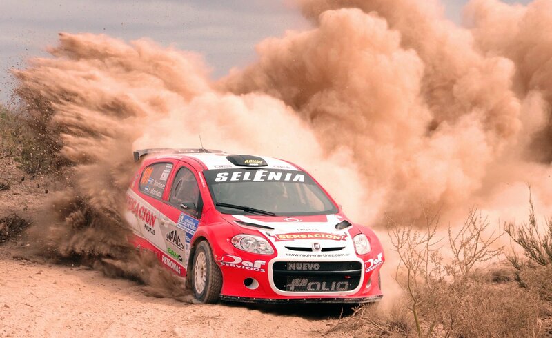 Rally Car Kicking Up Dust — Red