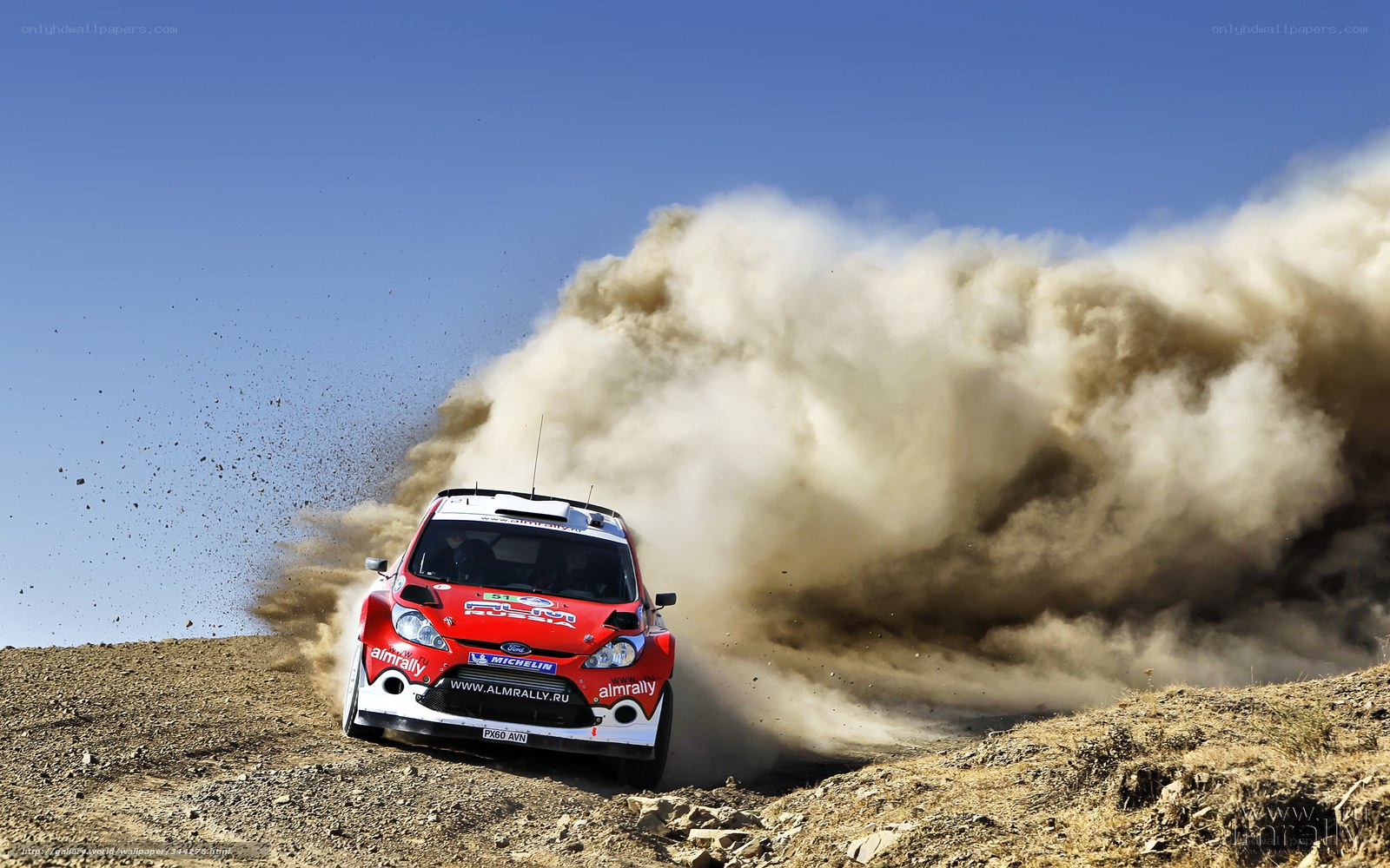 Rally car kicking up dust