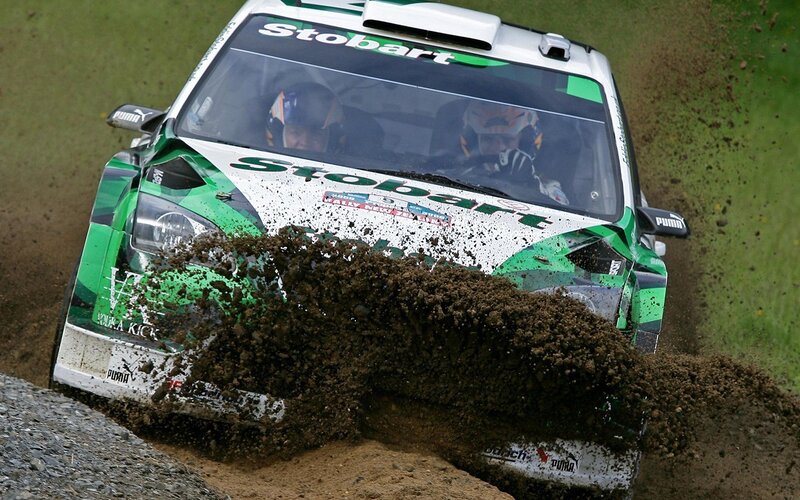 Rally Car Kicking Up Mud — Green