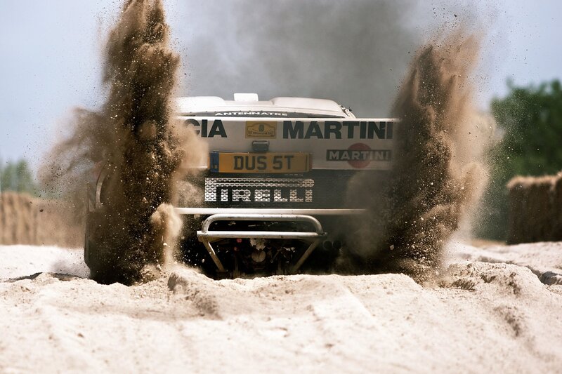 Rally Car Kicking Up Sand — Brown