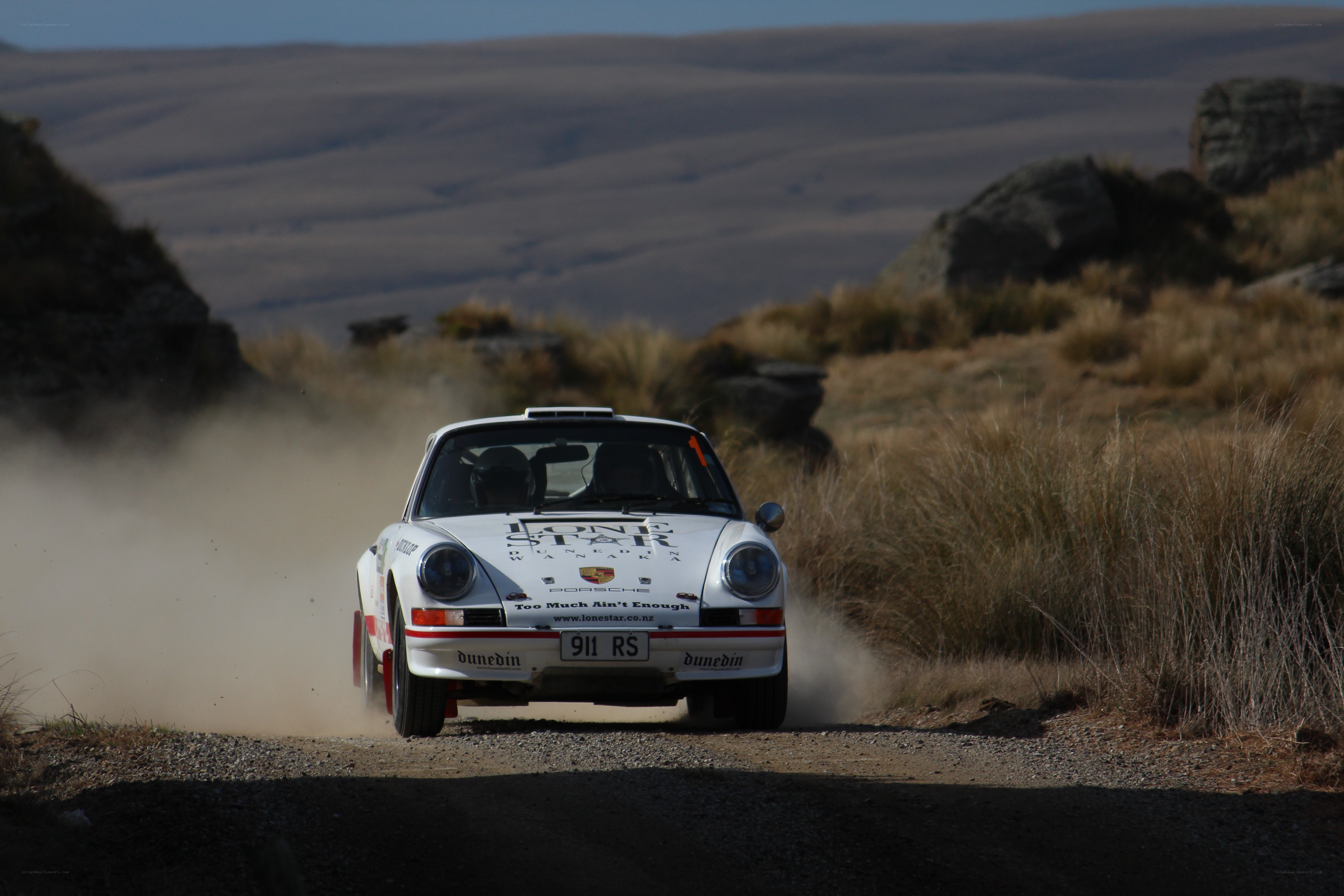 Rally car on a dusty road
