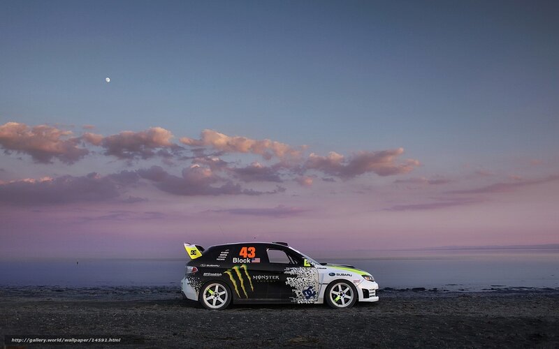 Rally car on beach at dusk