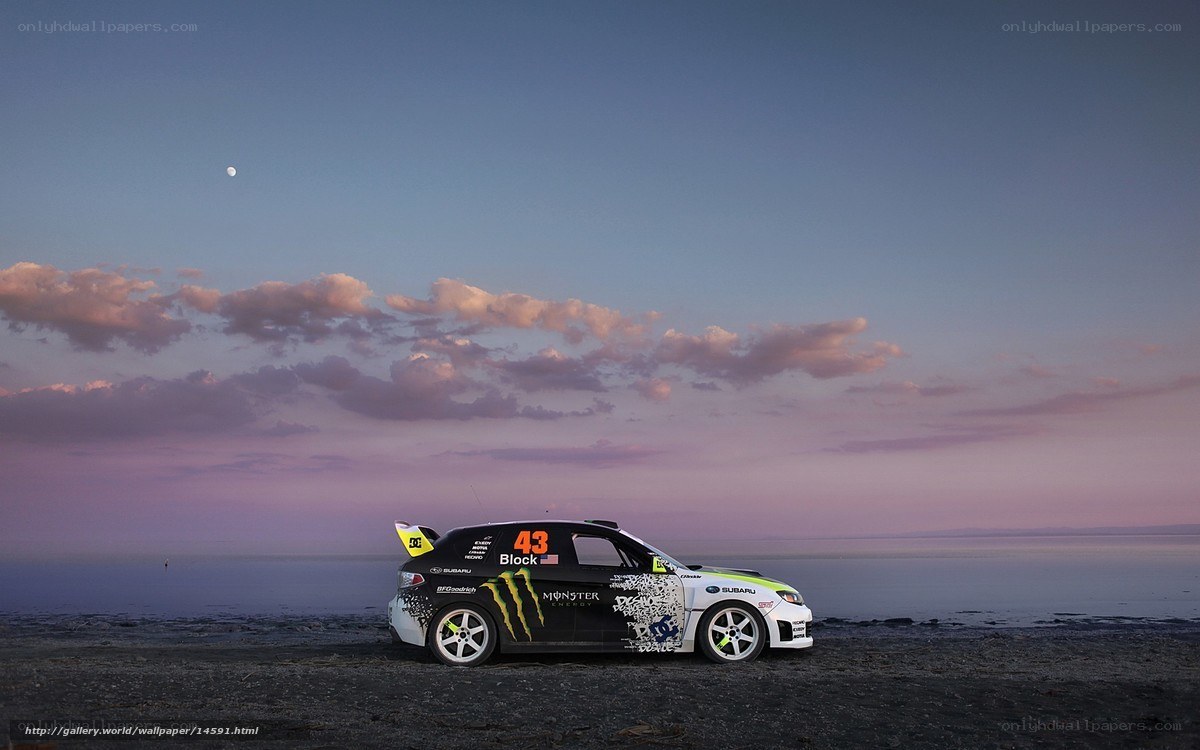 Rally car on beach at dusk