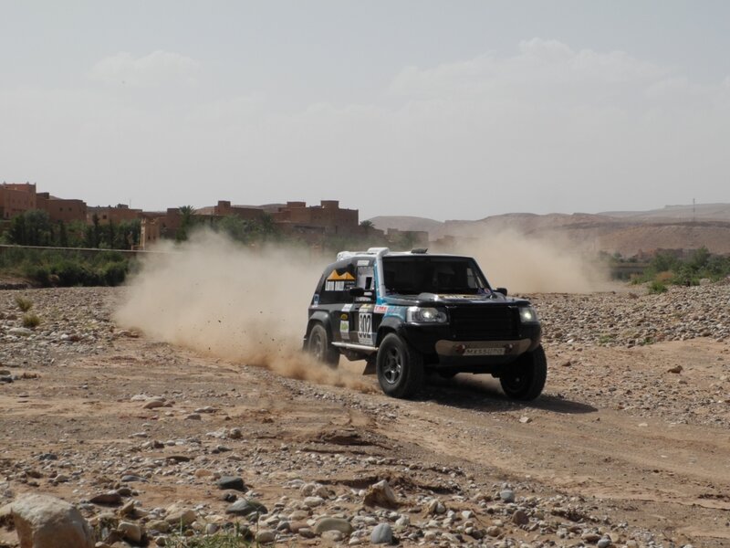 Rally Car on Dirt — Brown, Dynamic, Afternoon, Photograph, Dust, Rocks