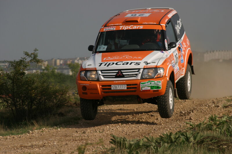 Rally Car on Dirt — Orange