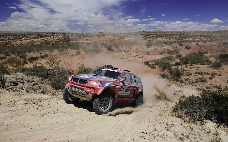 Rally Car on Dirt — Red, Dynamic, Afternoon, Photograph, Dust, Desert