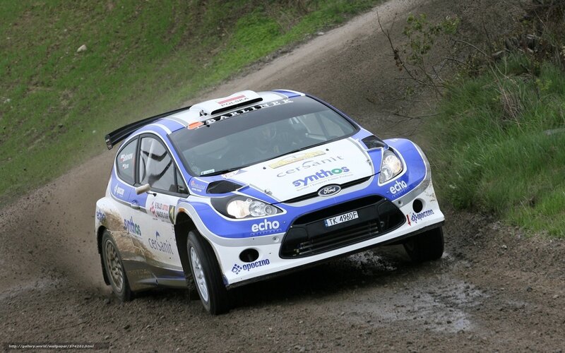 rally car on dirt road
