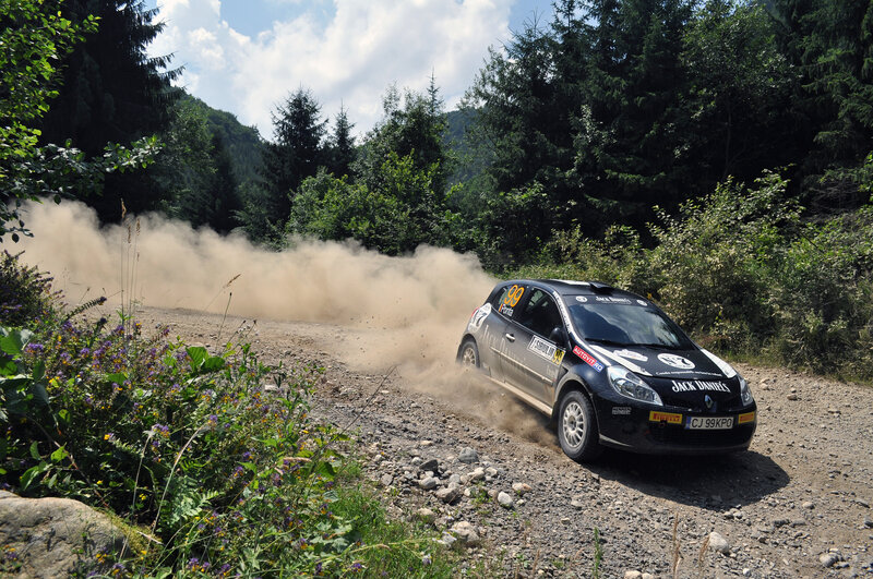 Rally Car on Dirt Road — Black, Dynamic, Afternoon