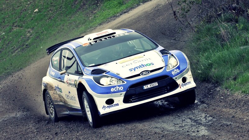 Rally Car on Dirt Road — Blue, Dynamic, Afternoon, Photograph, Dirt Road, Grass