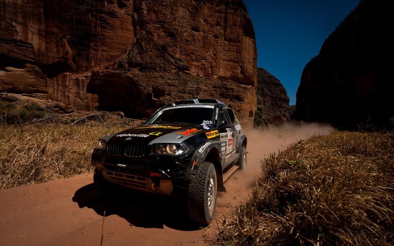Rally Car on Dirt Road — Brown, Dramatic, Afternoon