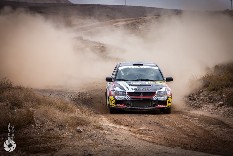 Rally Car on Dirt Road — Brown, Dynamic, Afternoon, Photograph, Dust Cloud, Driver