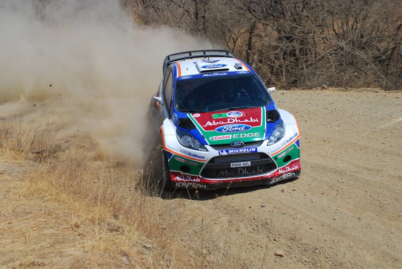 Rally Car on Dirt Road — Brown, Dynamic, Afternoon, Photograph, Dust, Trees, White