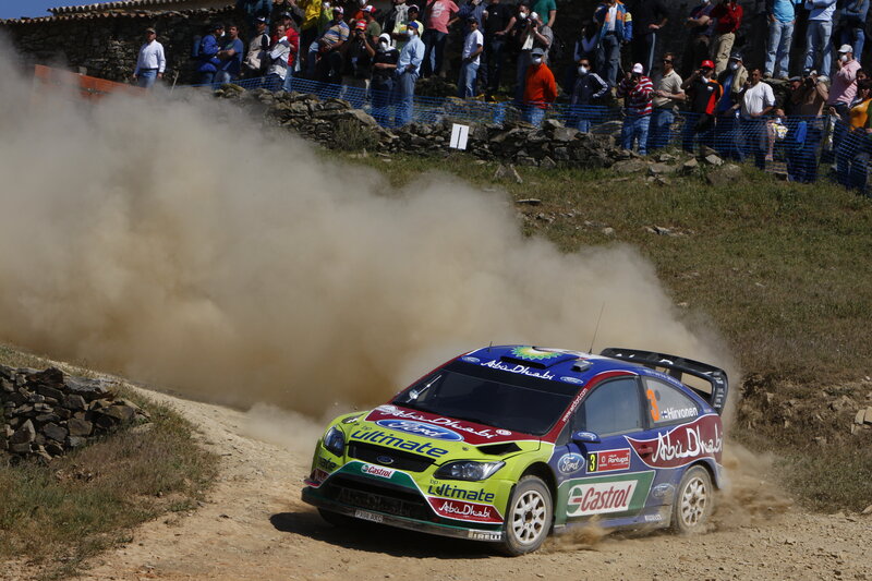 Rally Car on Dirt Road — Green, Dynamic, Afternoon, Photograph, Crowd, Dust Cloud