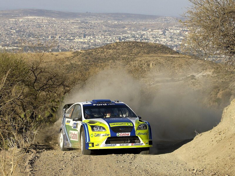 Rally Car on Dirt Road — Green, Dynamic, Afternoon, Photograph, Dust Cloud, Cityscape